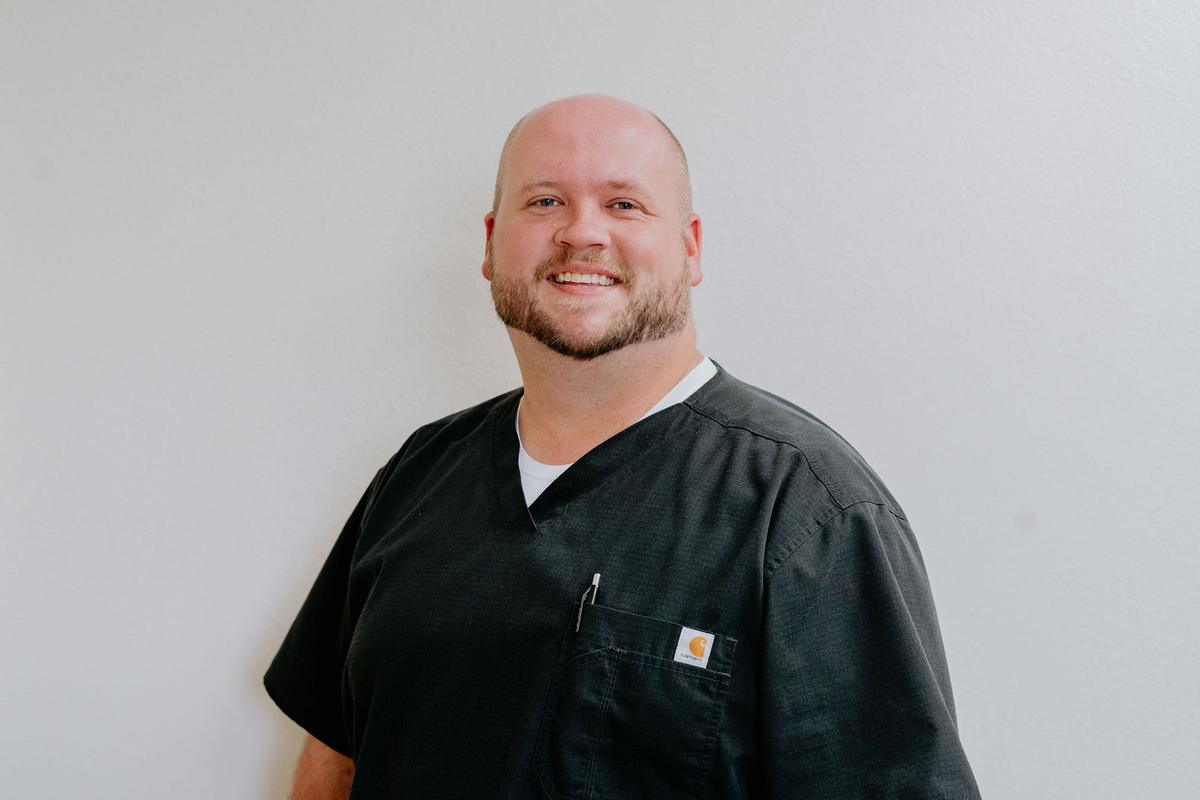One of our providers in black scrubs